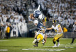 STATE COLLEGE, PA - NOVEMBER 05:  Saquon Barkley #26 of the Penn State Nittany Lions flies over Brandon Snyder #37 of the Iowa Hawkeyes while carrying the ball during the first quarter on November 5, 2016 at Beaver Stadium in State College, Pennsylvania.  (Photo by Brett Carlsen/Getty Images) *** Local Caption *** Saquon Barkley; Brandon Snyder